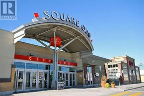 Mississauga (City Centre) condo for rent - The front of a building with a sign that says "Square One City Centre".