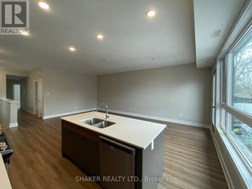 Ottawa fourplex for rent - A kitchen with a sink and a window.
