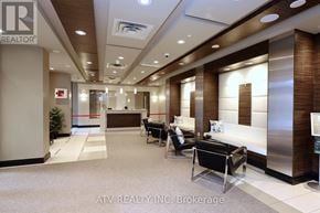 Toronto (Islington-City Centre West) condo for rent - A reception area with a desk and chairs.