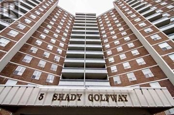 Toronto (Flemingdon Park) condo for rent - A tall building with the words "5 Shady Golfway" on the front.
