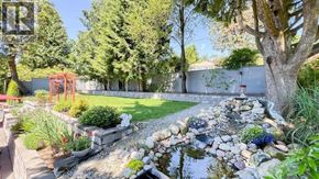 West Vancouver apartment for rent - A garden with a pond and a red sculpture.
