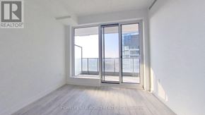 Toronto (Newtonbrook East) condo for rent - A room with a large window and sliding glass doors.