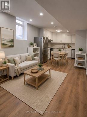 Richmond Hill (Rouge Woods) apartment for rent - A well-lit, modern kitchen and living room with wooden floors and furniture.