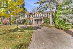Toronto (Bridle Path-Sunnybrook-York Mills) apartment for rent - A large house with a driveway in front of it.