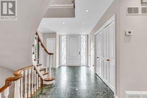 Toronto (Bridle Path-Sunnybrook-York Mills) apartment for rent - A hallway with a staircase and a white door.