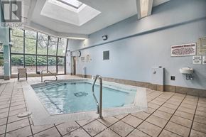 Toronto (Steeles) condo for rent - A pool inside a building with a skylight above it.