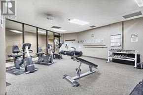 Toronto (Steeles) condo for rent - A gym with a variety of equipment including treadmills, stationary bikes, and weight racks.