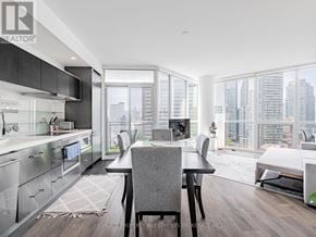 Toronto (Church-Yonge Corridor) condo for rent - A modern kitchen with a dining table and chairs.