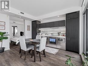 Toronto (Church-Yonge Corridor) condo for rent - A modern kitchen with a dining table and chairs.