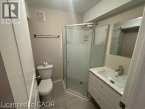 Kitchener apartment for rent - A small bathroom with a toilet, sink and shower.
