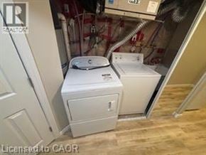 Kitchener apartment for rent - A white washer and dryer in a small, enclosed space.