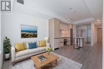 Vaughan (Beverley Glen) condo for rent - A living room with a couch, a coffee table, and a painting on the wall.