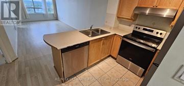 Toronto (Bayview Village) condo for rent - A kitchen with a sink and stove top oven.
