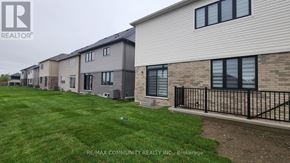 Clarington (Courtice) apartment for rent - A row of houses with the RE/MAX Community Realty logo in the corner.