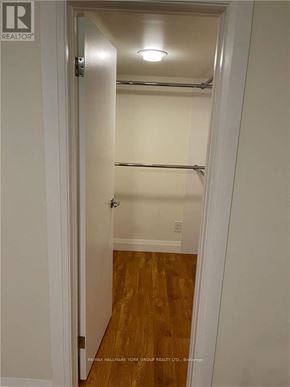 Toronto (Corso Italia-Davenport) apartment for rent - A white door with a handle and a sign on it.