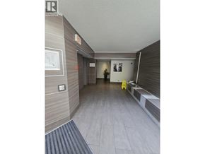 Vancouver apartment for rent - A hallway with a sign that says "EXIT" on the wall.