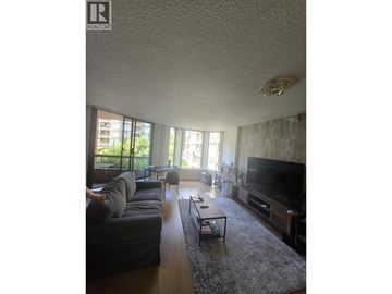 Vancouver apartment for rent - A living room with a grey couch and a black coffee table.