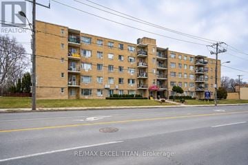 Toronto (Bedford Park-Nortown) condo for rent - Apartment building with the sign RE/MAX EXCEL TITAN Brokerage in front of it.