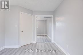 Oshawa (Mclaughlin) apartment for rent - A room with a door and a glass door leading to another room.