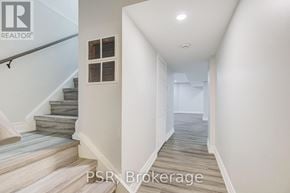 Oshawa (Mclaughlin) apartment for rent - A hallway with a staircase and a window.