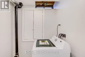 Oshawa (Mclaughlin) apartment for rent - A white PSR Brokerage machine sits in a room with white walls.