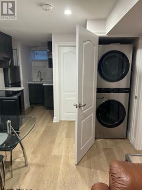 Toronto (Eglinton East) apartment for rent - A modern kitchen with a glass table and a washing machine in the laundry room.