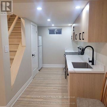 Newmarket (Stonehaven-Wyndham) apartment for rent - A kitchen with a sink and cabinets.