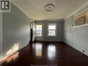 Windsor apartment for rent - A room with a wooden floor and a window.