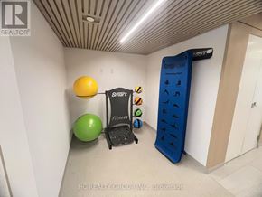 Mississauga (Mississauga Valleys) condo for rent - A room with a treadmill, exercise balls and a sign that says Smart Fitness.