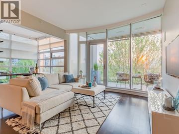 Vancouver apartment for rent - A living room with a white couch and a rug.