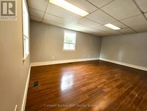 Wellington North (Mount Forest) multi-family for rent - A room with wooden flooring and a window.