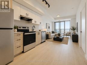 Burlington (Alton) condo for rent - A modern kitchen with wooden floors and stainless steel appliances.