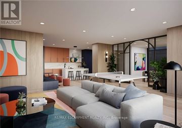Burlington (Alton) condo for rent - A modern living room with a pool table and a bar area.