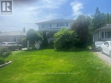 Belleville (Belleville Ward) apartment for rent - A well-maintained lawn in front of a house with a car parked in the driveway.
