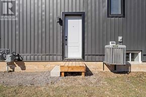 Welland (N. Welland) apartment for rent - A white door is on a grey building.
