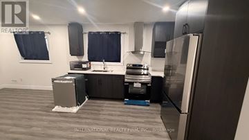 London South (South U) apartment for rent - A kitchen with a refrigerator, stove, and oven.