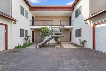 Santa Paula apartment for rent - A two-story house with a balcony and a staircase.