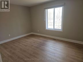 Mcnab/Braeside apartment for rent - A room with a window and wooden flooring.