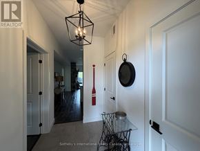 Blue Mountains condo for rent - A hallway with a table and chairs in the middle.