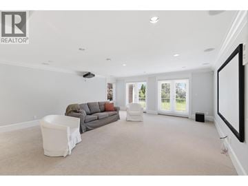 West Vancouver apartment for rent - A living room with a grey couch and a white chair.