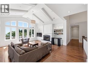 West Vancouver apartment for rent - A spacious living room with a fireplace and a large couch.