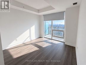 Toronto (Bay Street Corridor) condo for rent - A room with a view of the city through the windows.