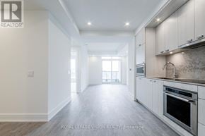 Toronto (Dovercourt-Wallace Emerson-Junction) condo for rent - A spacious kitchen with white cabinets and a central island.