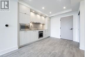 Toronto (Dovercourt-Wallace Emerson-Junction) condo for rent - A modern kitchen with a white cabinetry and a built-in oven.