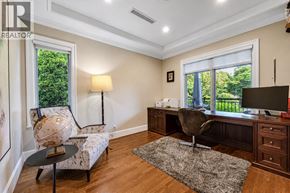 Vancouver apartment for rent - A well-lit room with a desk, chair, and a couch with a patterned cushion.