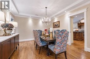 Vancouver apartment for rent - A dining room with a table set for two and a chandelier hanging from the ceiling.