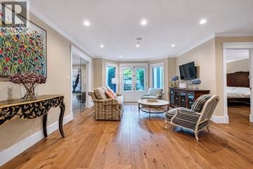 Vancouver apartment for rent - A living room with a black and white patterned table and striped chairs.