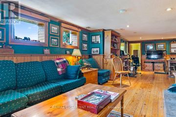 Mississauga (Lorne Park) apartment for rent - A living room with a blue couch and wooden floors.