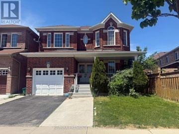 Milton (Cl Clarke) apartment for rent - A house with a garage and a driveway in front.