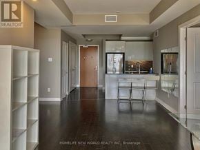 Ottawa condo for rent - A bedroom with a large bed and a view of the city.